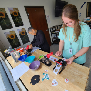 Teachers make buttons during Teacher Time in the Makerspace. Click here to register