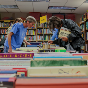 Customers search for books at the Friends of the Library Book Sale