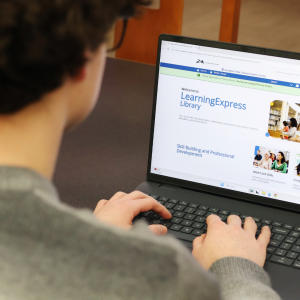 Student browses the LearningExpress Library database on laptop