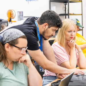 Teachers and library staff member work in the Makerspace during Teacher Time