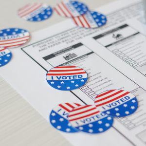 "I voted" stickers lay on top of a sample ballot for the upcoming election.