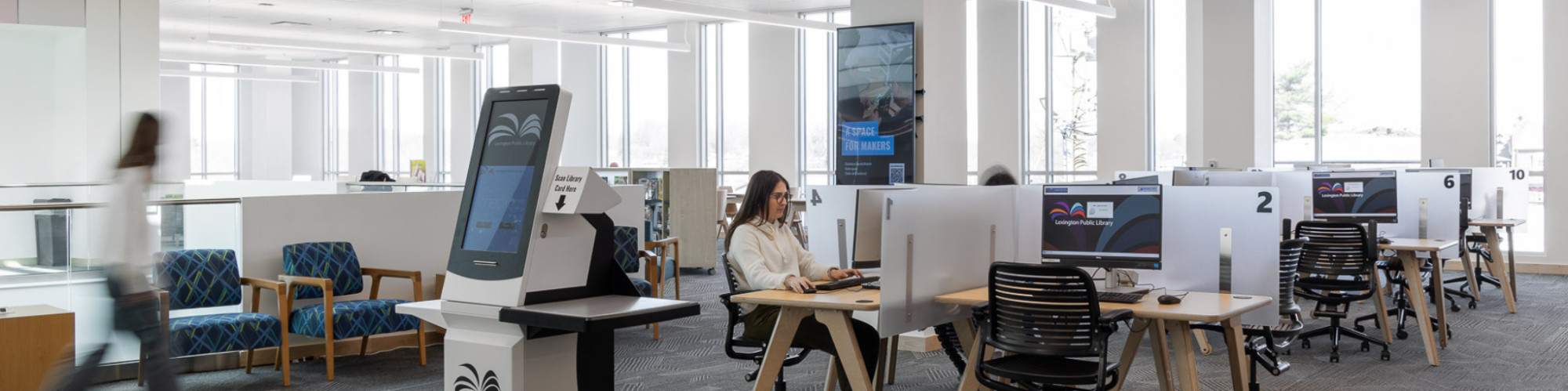 Students and teachers work on computers at the Marksbury Family Branch