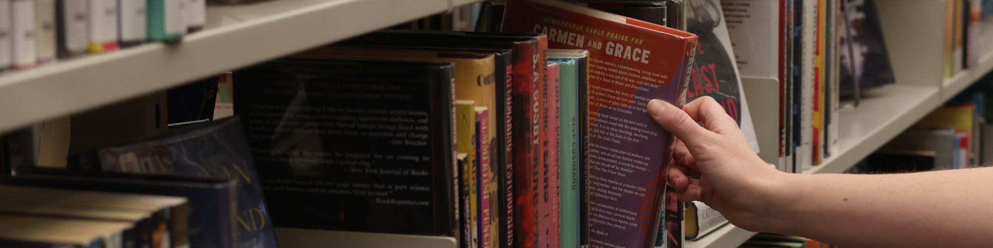 Patron browsing bookshelves