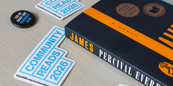 Pulitzer Prize winner “James” by Percival Everett book on a table with stickers that read "Community Reads 2026"